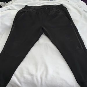 Adidas black sweat pants, zip pockets, tap. Leg
